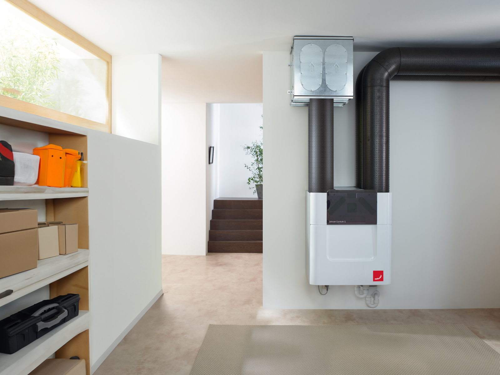Fresh Air Throughout the Home Compact Zehnder ventilation unit with ductwork installed in a home hallway